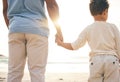 Back, beach and a father holding hands with his son as a family at sunset by the ocean or sea together. Children, love Royalty Free Stock Photo
