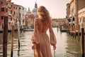 Back beautiful slim chic girl with long blond hair in golden hour against the background Venice canal Generative AI