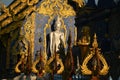 A large white Buddha image in the forbidding posture at The back of the beauty blue chapel of Wat Rong Suea Ten temple