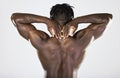 Back, body and muscular with a model black man posing in studio on a gray background for fitness or exercise. Muscle Royalty Free Stock Photo