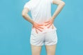 Back body of the woman put her hands on back or waist area mark red at spot of ache, backpain Health-care concept isolated on Royalty Free Stock Photo