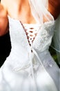 Back of the bride in beaded corset - outdoors Royalty Free Stock Photo
