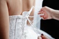 On a back of the bride tie a wedding dress Royalty Free Stock Photo