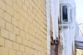 The back of the building is air-conditioned cafe on the wall covered with a thick layer of icicles