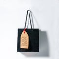 Back buying bag with a Black friday inscription in a cardboard