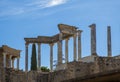 Back of the capitals and columns of the Roman theater of Merida, with the midday sun illuminating the columns and the ruins of Royalty Free Stock Photo