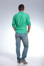 Back of a casual man with hands in pockets Royalty Free Stock Photo