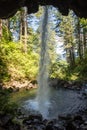Back cave view of Ponytail Falls in the Columbia River Gorge waterfall area of Oregon Royalty Free Stock Photo
