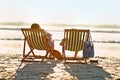 Back, chair or couple at sea to relax for holiday, vacation or anniversary romance in summer. Travel, magazine or woman Royalty Free Stock Photo