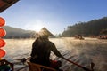 Back of Chinese style rower tourist boat attraction at Ban Rak Thai village, Mae Hong Son, Thailand during winter morning sunrise Royalty Free Stock Photo