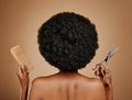 Back, comb and scissors with a black woman in studio on a brown background for a haircut. Salon, afro and haircare with Royalty Free Stock Photo