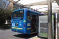 Back door of a blue SITP bus massive transportation system at bus stop in north of the city