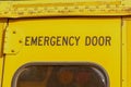 Back door on the bus. Emergency exit on a yellow school bus. Royalty Free Stock Photo
