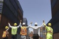 The back of effectively managing staff worker team in line together, holding hands and raising their hands up o celebrate their Royalty Free Stock Photo