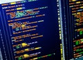 Back-end coding workflow of the web developing. Colorful code on dark blue background Royalty Free Stock Photo
