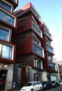 Modern rusty Ironbank with piled up boxes and glass windows. Mixed-used development on Karangahape Road, Auckland, New Zealand