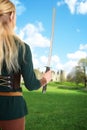 Back of female elf holding sword Royalty Free Stock Photo
