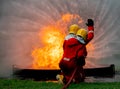 Back of firefighter team support together to distinguish fire using water curtain to control area of fire