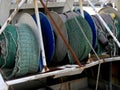 the back of a fishing boat, fishing nets rolled up on whinches Royalty Free Stock Photo