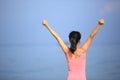 cheering fit woman seaside