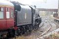 Back five steam train leaving Carnforth station