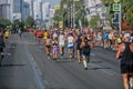 back group male and female runners running in Europe-Asia Marathon