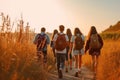 Back of group walking teenager students with backpack at sunset. Generative AI