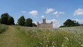 Back of Highclere Castle in flower field Royalty Free Stock Photo