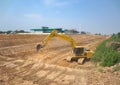 Back hoe is digging the ground to make a big pond Royalty Free Stock Photo