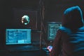 Back hooded hacker using malicious software hack corporate data center. malefactor hidden underground in dark place