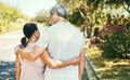 Back, hug and a senior couple on a walk for bonding, love and exercise in the morning. Happy, relax and an elderly man Royalty Free Stock Photo