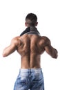 Back of hunky male bodybuilding model drying himself with towel