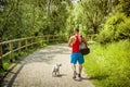 Back of hunky sportsman with pet outdoor