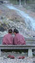 Back of Japanese girls who relaxing with foot spa onsen among natural hot spring water fall at Gunma Japan. Royalty Free Stock Photo