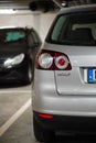 Back lamp of a parked silver colored Volkswagen Golf Plus in a parking