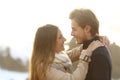 Back light of a couple looking each other