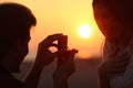 Back light of a proposal of marriage at sunset Royalty Free Stock Photo