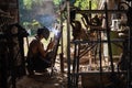 Back light silhouette of a welder working metal in his workshop