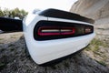 Back lights of white powerfull american muscle car in career Royalty Free Stock Photo