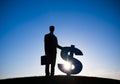 Back Lit Businessman holding Dollar sign Royalty Free Stock Photo