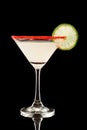 Back lit key lime martini with red sugar Royalty Free Stock Photo