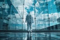 Back low angle view of window cleaner wearing protective suit and gloves standing in front of modern office building Royalty Free Stock Photo