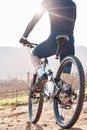Back of man, bicycle and cycling in nature, countryside and training for triathlon, sports and flare. Cyclist, mountain