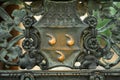 the back of a metal bench with decorative metal decoration on it