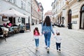 Back of mother with daughters walking at street of Bratislava, Slovakia Royalty Free Stock Photo