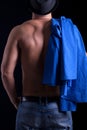 Back of muscular man with hat ,on black background Royalty Free Stock Photo