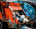 Back of old garbage truck with waste. Urban waste management con Royalty Free Stock Photo