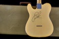 Back of old vintage electric guitar and case with the signature autograph of rock star Leon Russell