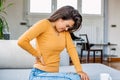 Back Pain. Closeup Of young woman Having Spinal Or Kidney Pain, Backache. Girl Suffering From Painful Feeling, Muscle Or Nerve Royalty Free Stock Photo