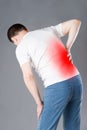 Back pain, kidney inflammation, man suffering from backache